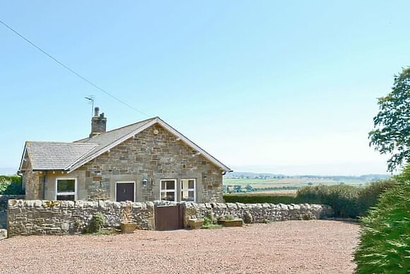 Heckley Cottage sits on a 14 acre estate two miles north of Alnwick, with logs included